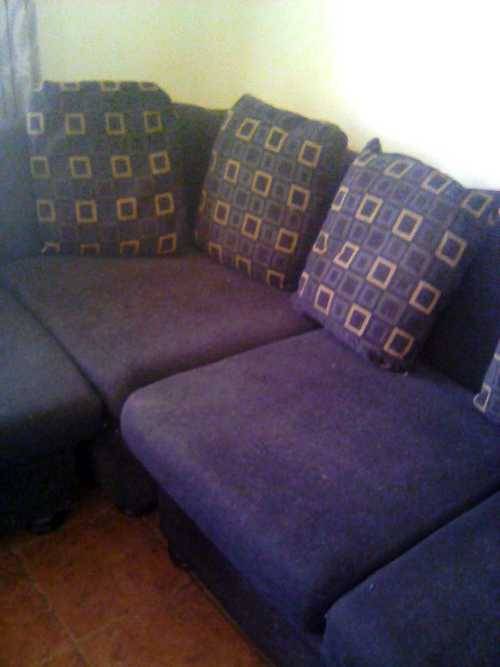 Black, L - shape, corduroy couch with cussions