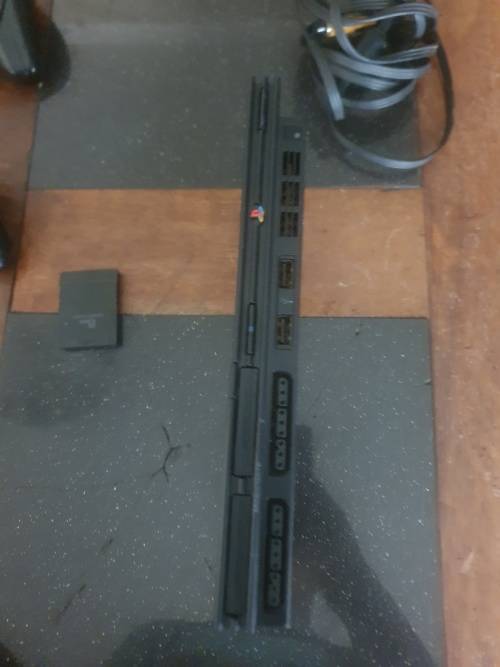 Sony PlayStation 2 plus remotes & 8G Memory Card