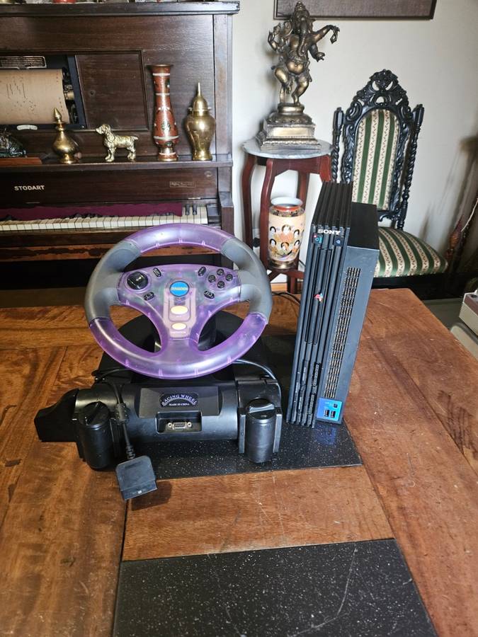 Sony PlayStation 2 with Expansion Box + a Steering Wheel