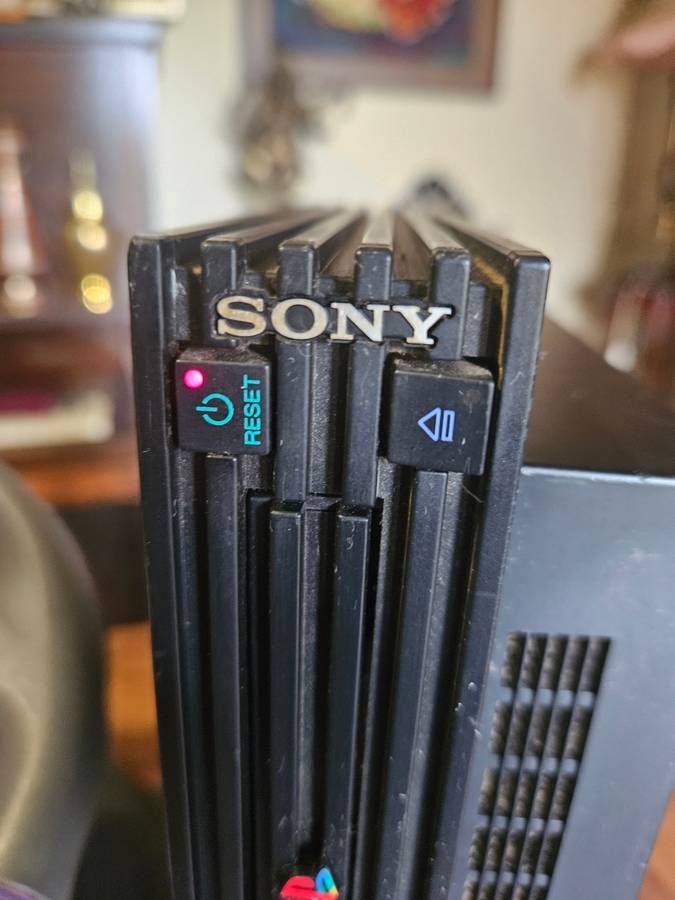 Sony PlayStation 2 with Expansion Box + a Steering Wheel