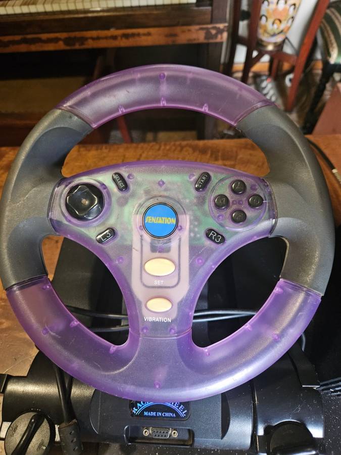 Sony PlayStation 2 with Expansion Box + a Steering Wheel