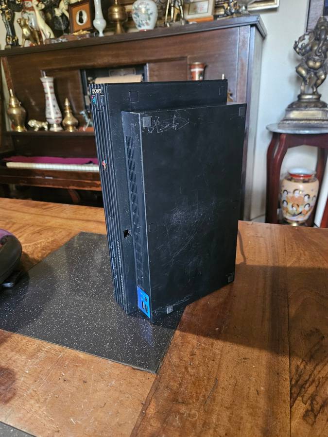 Sony PlayStation 2 with Expansion Box + a Steering Wheel