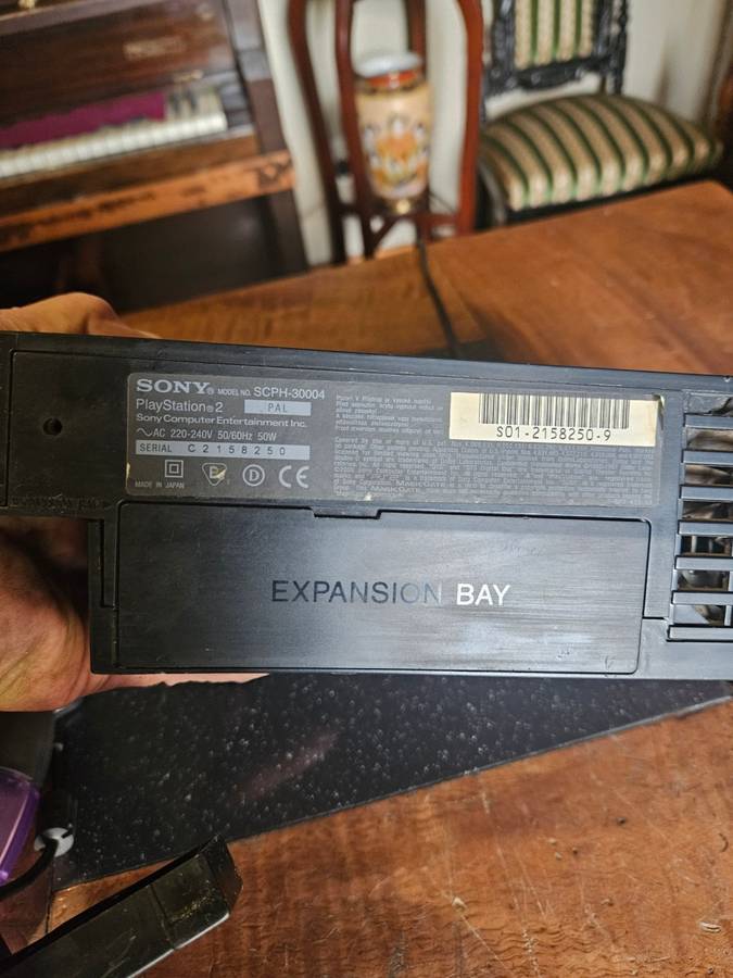 Sony PlayStation 2 with Expansion Box + a Steering Wheel