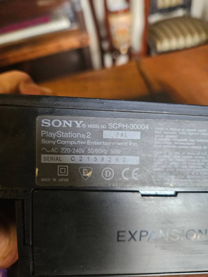 Sony PlayStation 2 with Expansion Box + a Steering Wheel