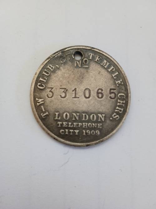 Tail Wagger club medallion