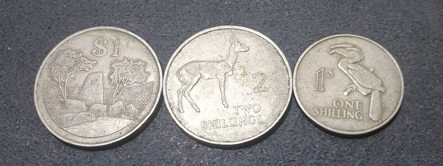 A SET OF THREE ZAMBIAN SHILLINGS & OTHERS.