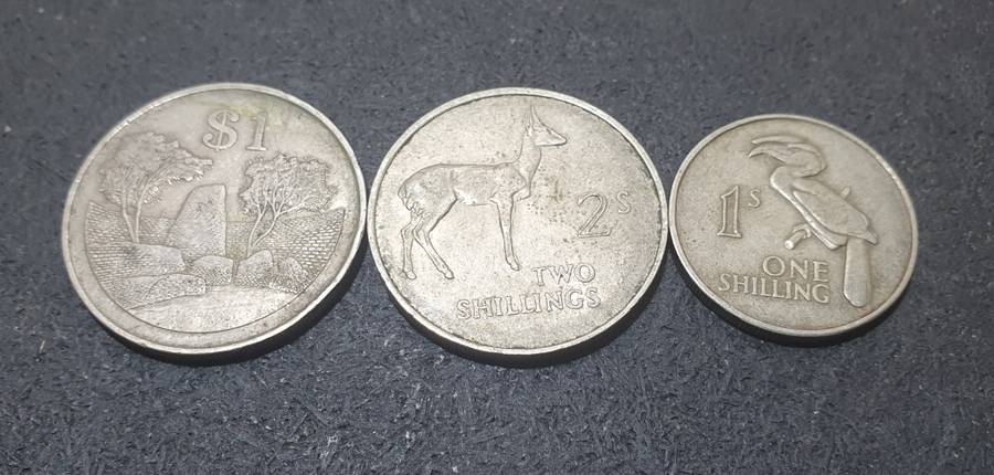 A SET OF THREE ZAMBIAN SHILLINGS & OTHERS.