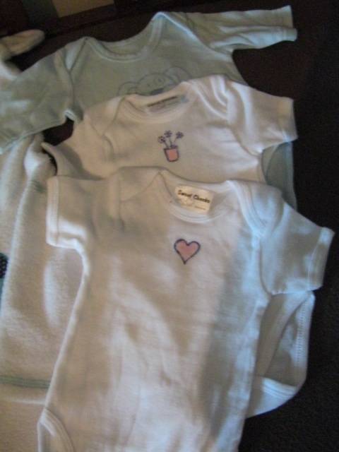 Lot of 11 babies' clothing, all newborn but 1 - R13.64 per item.