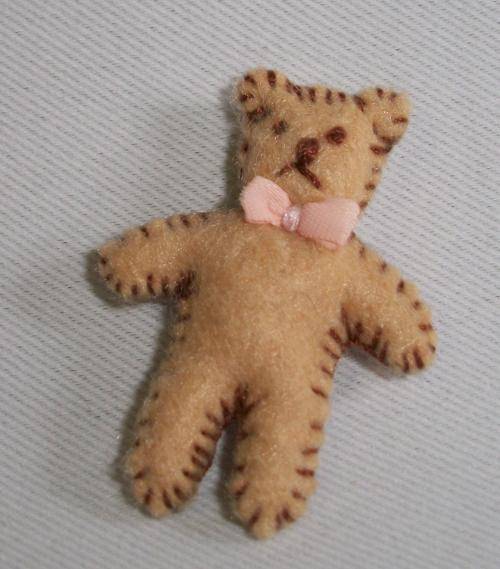 Tiny 3,5 cm felt teddy bear.