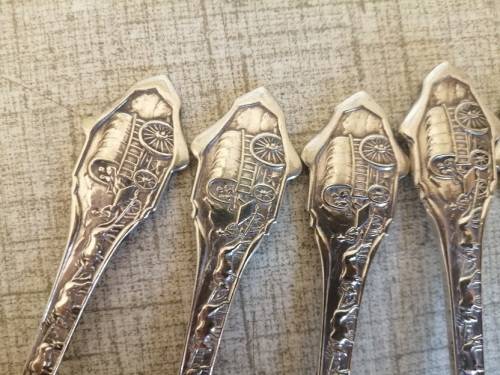 1838 Voortrekker Eeufees teaspoons and sugar spoon