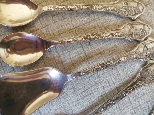 1838 Voortrekker Eeufees teaspoons and sugar spoon