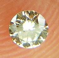 DIAMOND  - 0.10 CARAT LIGHT BROWN, SI1  ROUND BRILLIANT DIAMOND 3.05 x1.79mm