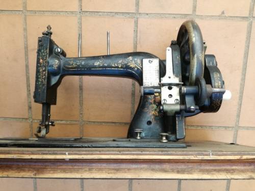 Antique sewing machine with box