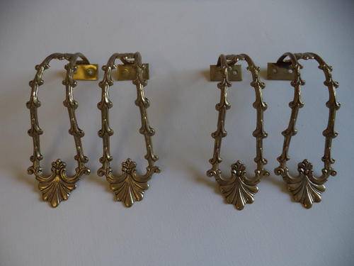 TWO PAIRS BRASS TIE BACKS