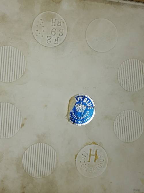 A Collection of three Delft tiles with windmill theme and one tile holder