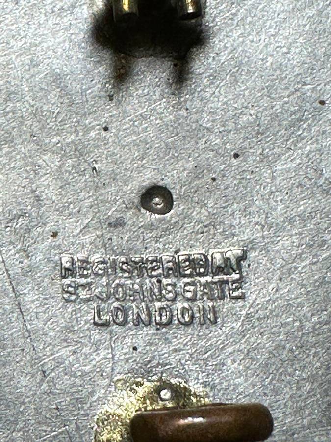 Rhodesian ST JOHNS - BERET BADGE METAL, Registered at St Johns Gate, London