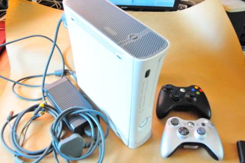 X Box 360 (chipped) with power supply and 2 wireless controllers and +- 65 games