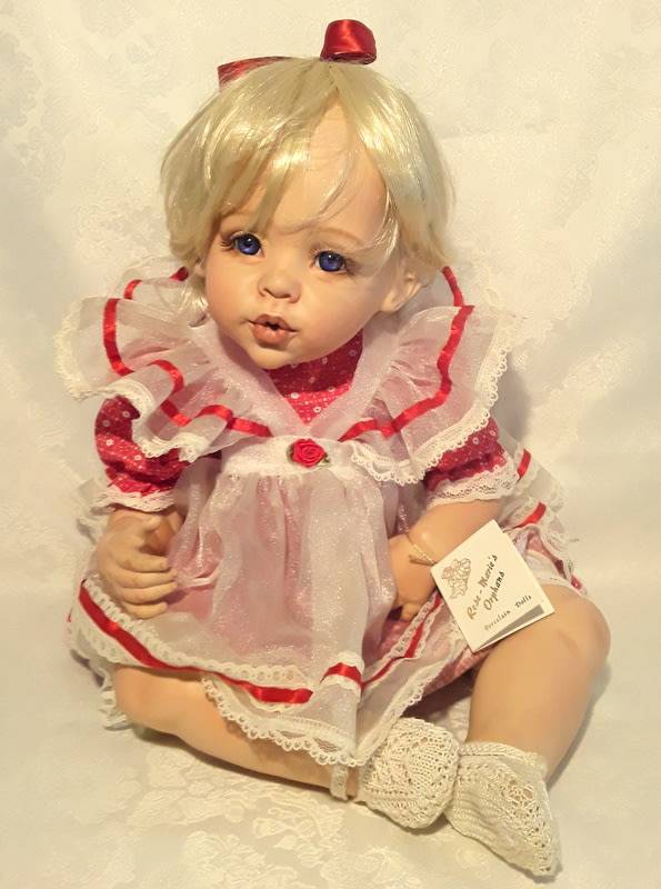Beautiful porcelain collectable doll.  Made by Rose- Marie's Orphans.