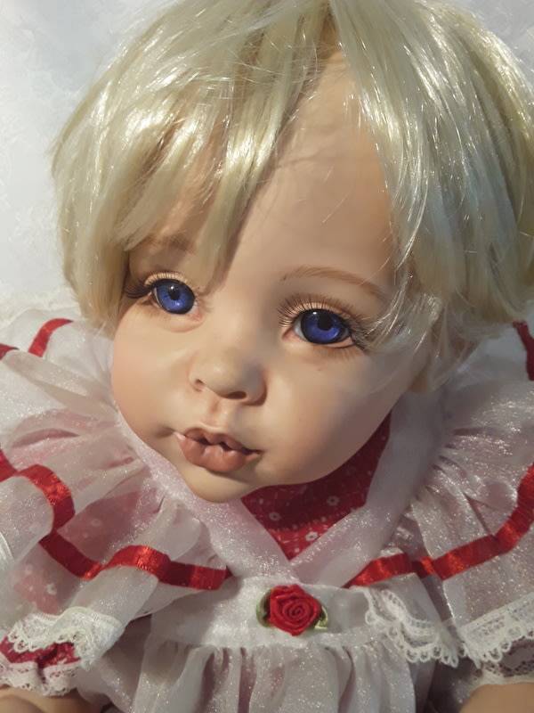 Beautiful porcelain collectable doll.  Made by Rose- Marie's Orphans.