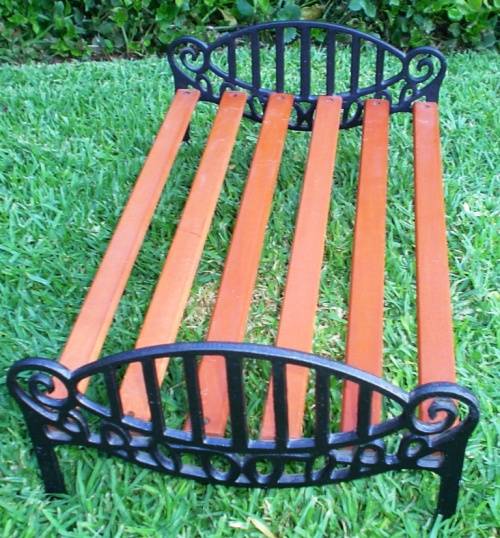 Beautiful and strong Doll wrought/cast iron and wood Cot/bed-good condition