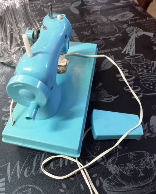 Cute vintage Toy Sewing machine made in Hong Kong, battery and hand operated