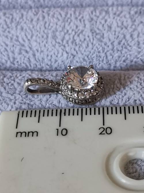 **R1 Auction**  Dazzling Silver Pendant