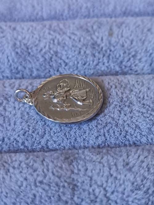 **R1 Auction**  Silver St. Christopher Pendant
