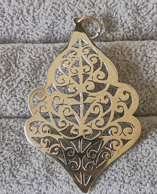 Detailed Silver Pendant