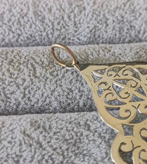 Detailed Silver Pendant