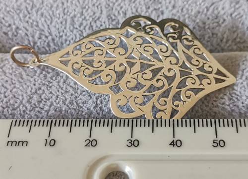 Detailed Silver Pendant