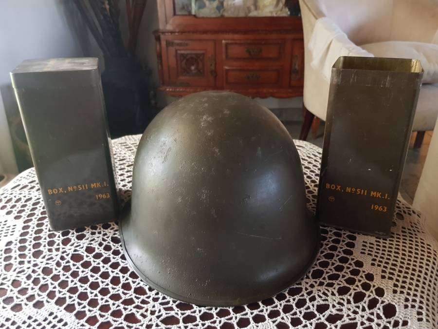 ARMY HELMET AND EXPLOSIVE CANISTERS