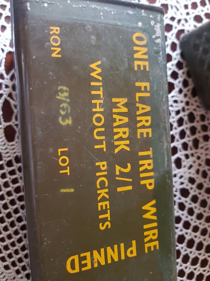 ARMY HELMET AND EXPLOSIVE CANISTERS