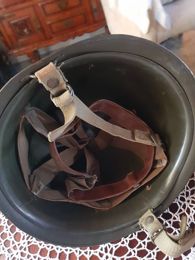 ARMY HELMET AND EXPLOSIVE CANISTERS