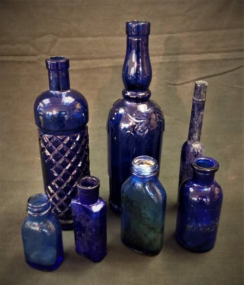Lot of Seven Blue Glass Bottles