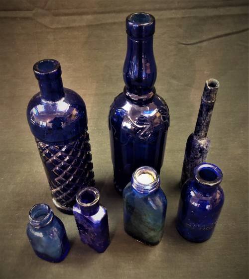 Lot of Seven Blue Glass Bottles