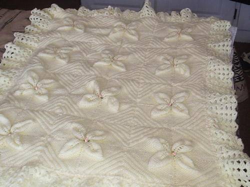Beautiful hand-knitted baby blanket in pale yellow