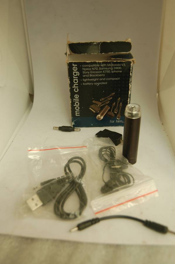 POCKET SIZED OLDER CELL PHONE CHARGER WITH VARIETY OF CONNECTIONS