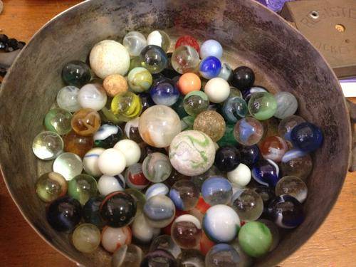 A very old leather bag of old vintage marbles
