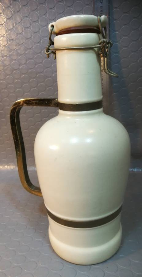 Very large beautiful ceramic and brass wine bottle