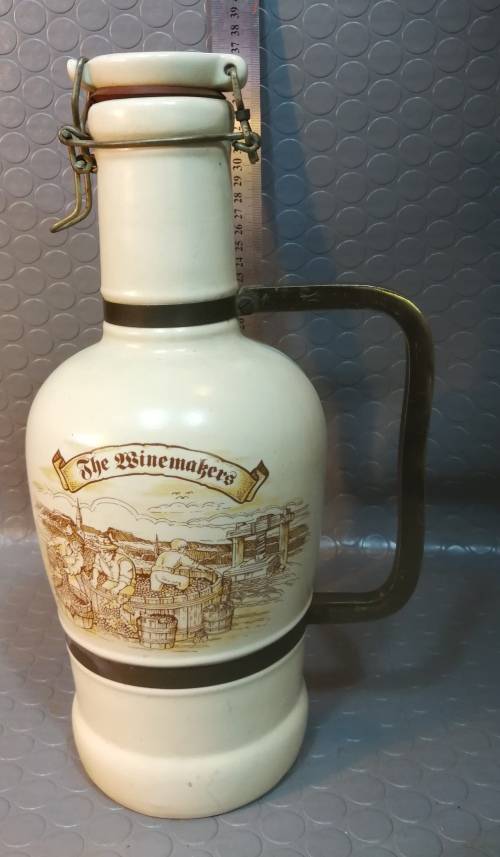 Very large beautiful ceramic and brass wine bottle