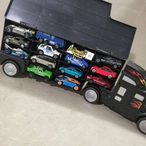 HUGE HOT WHEELS STORAGE TRUCK FILLED ON BOTH SIDES WITH HIGHLY COLLECTIBLE HOT WHEELS CARS