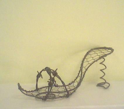Cheeky high heel shoe with barbwire detail.