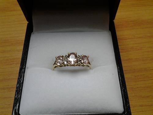 Sold 9 CT Gold ring with Pink stones