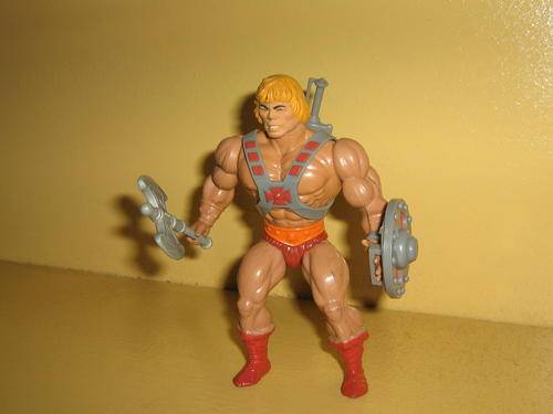 MOTU Heman. All weapons but rubbers on legs worn. Excesive playwear. Still a classic.