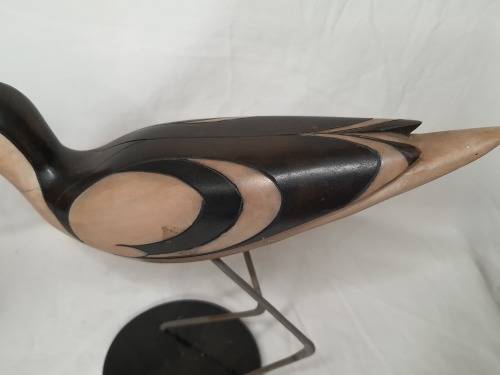 A LIMITED EDITION PAIR OF AVOCET CARVED WOODEN FIGURINES