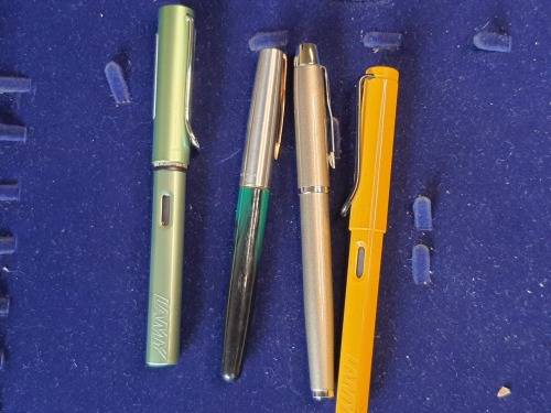 A COLLECTION OF 4 FOUNTAIN PENS SOLD AS IS