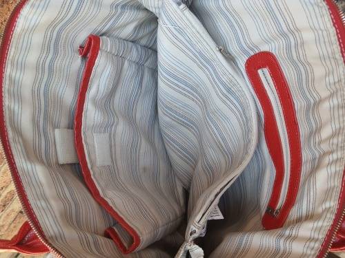 A RED TOTE HAND BAG MADE BY BARON