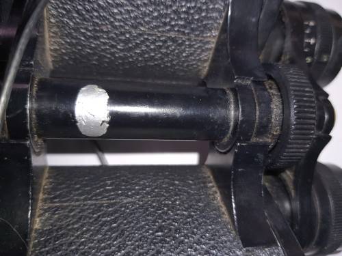 A VINTAGE BINOCULARS SOLD AS IS