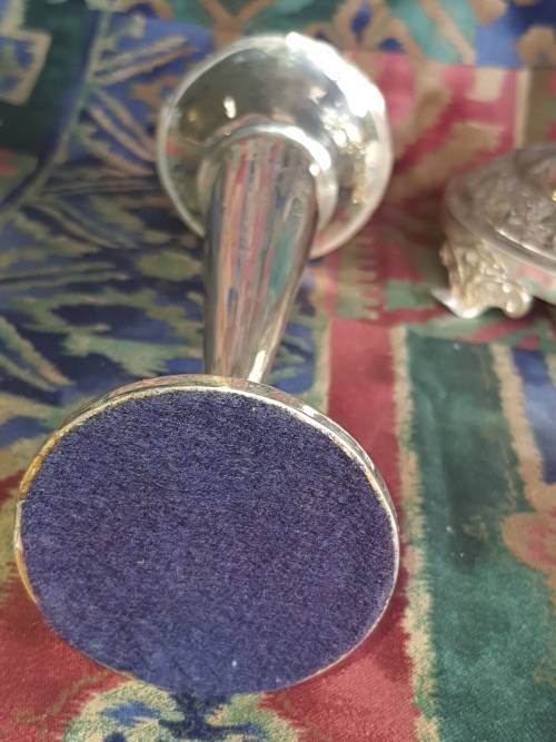 TWO VINTAGE EPNS OR SILVER PLATED VASE AND A ORNATE CANDLE STAND SOLD AS IS