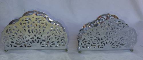 TWO STAINLESS STEEL ORNATE DESIGNED SERVIETTE HOLDERS IN MINT CONDITION SOLD AS IS
